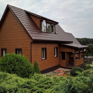 Отделка фасада панелями Vox Max 3 дуб золотой 150 м²