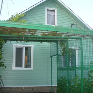Отделка фасада сайдингом Канада Плюс Престиж Фисташковый