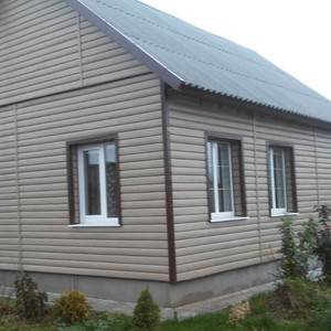 Отделка фасада сайдингом Тимберблок Дуб натуральный