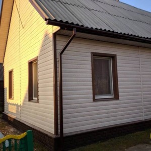 Отделка фасада сайдингом Тимберблок Ясень белый