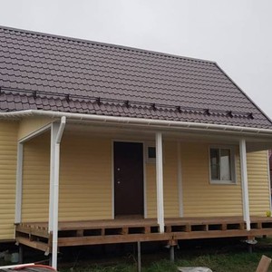 Отделка фасада сайдингом Альта-Профиль BH3 малый двухпереломный золотистый 120м2